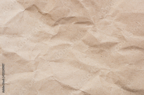 Recycled crumpled light brown paper texture or paper background