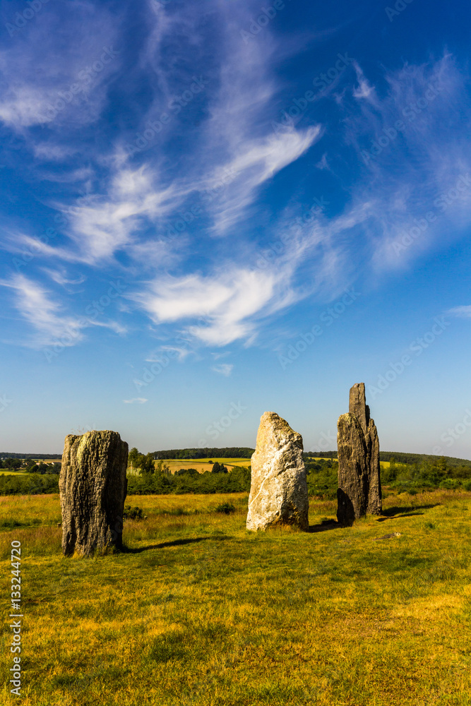 Standing stones in a green field