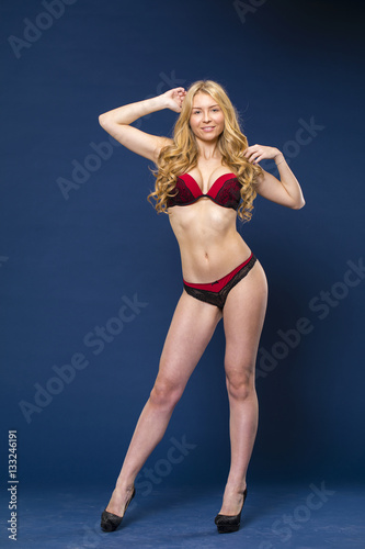 Full portrait of sexy lady in red underwear © Andrey_Arkusha