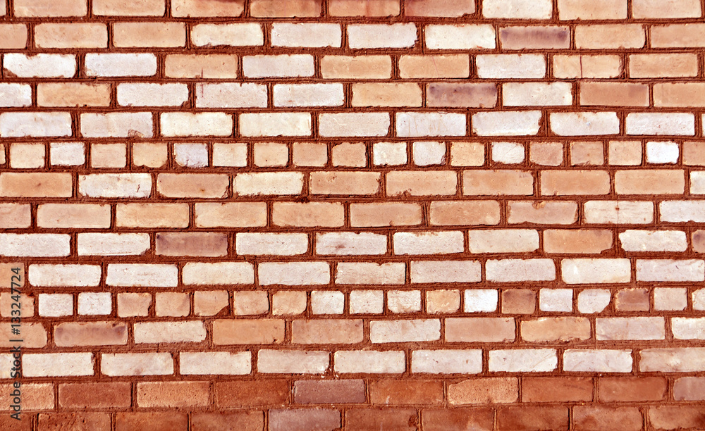 Obraz premium red toned old brick wall texture.