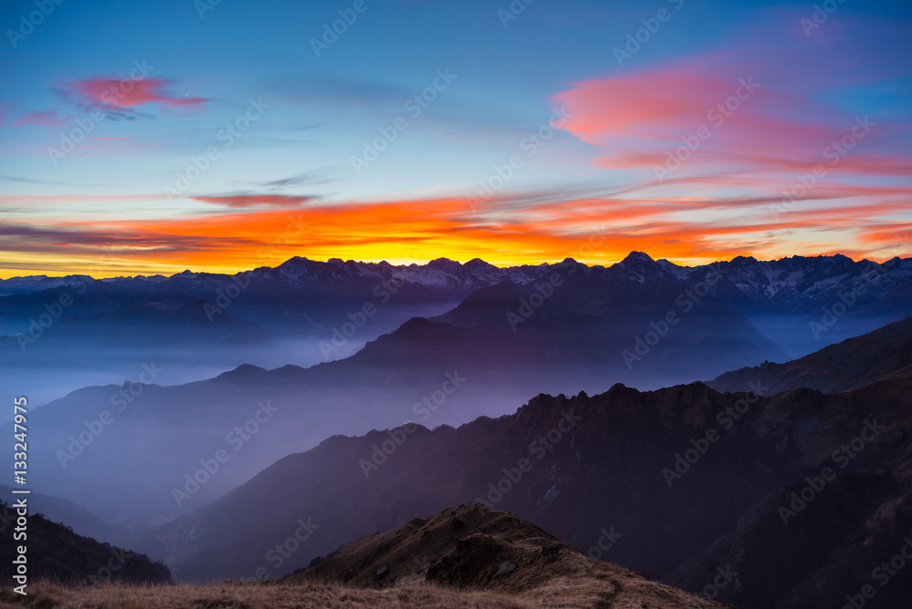 Mountain silhouette and stunning sky at sunset