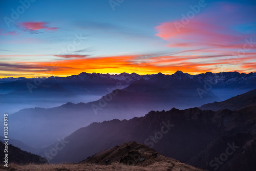 Mountain silhouette and stunning sky at sunset