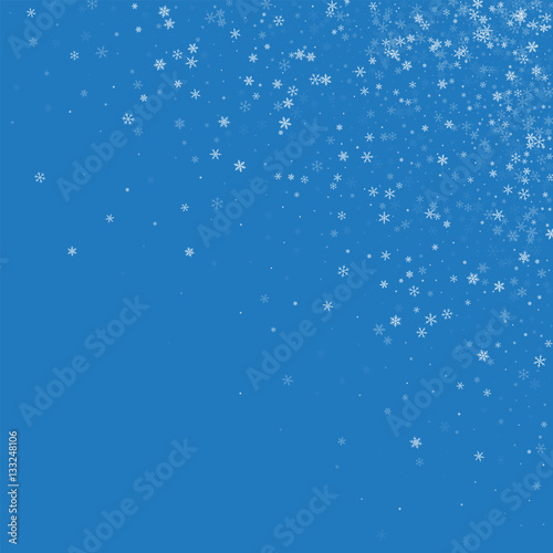 Beautiful snowfall. Scattered top right corner on blue background. Vector illustration.