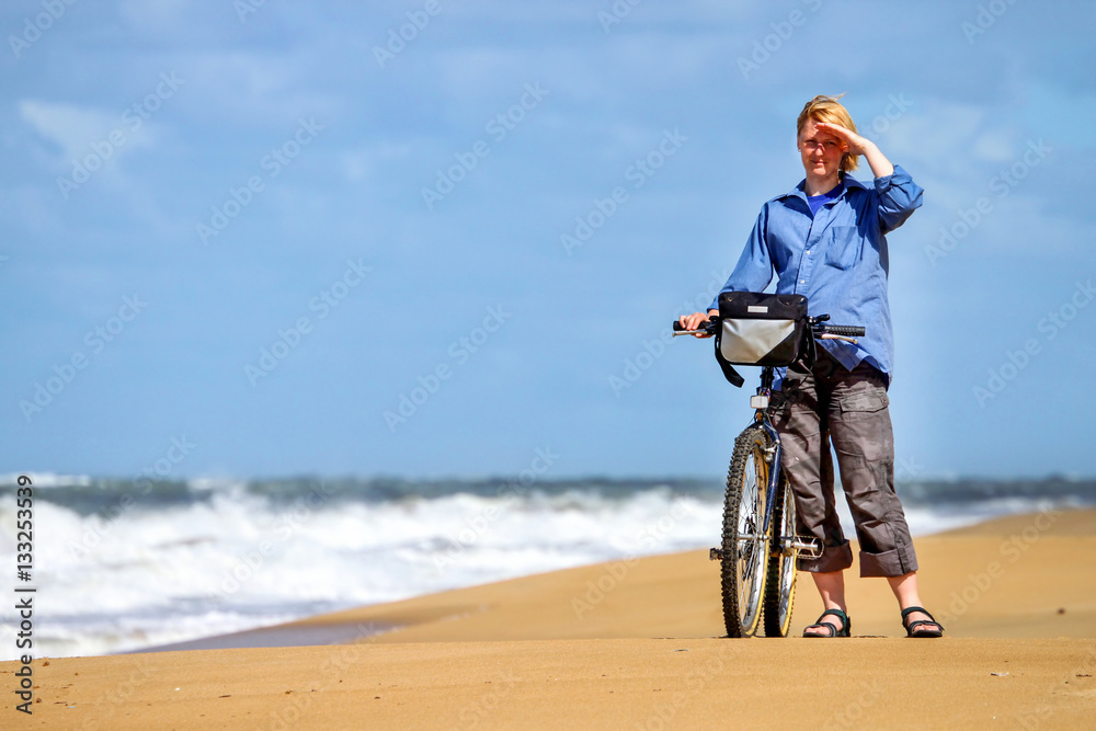 Fototapeta premium A girl with a bicycle
