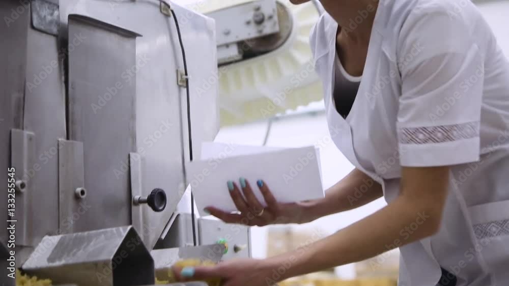 woman carries out quality control at the pasta factory