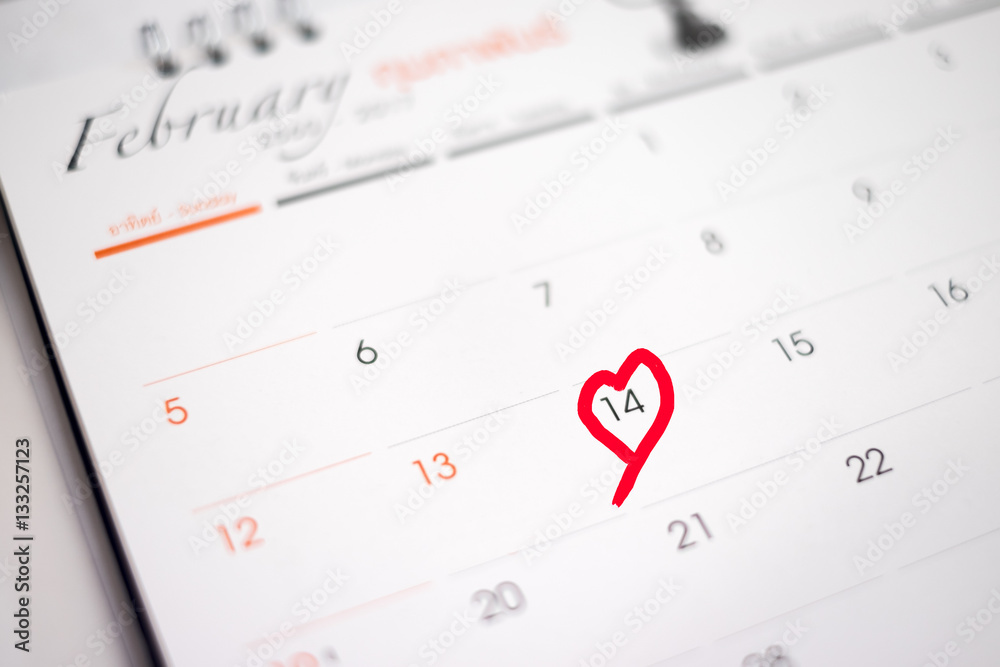 Calendar page with the red hearts on February 14 of Saint Valentines day Calendar page with the red hearts on February 14 of Saint Valentines day