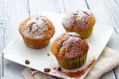 Muffins on a wooden table
