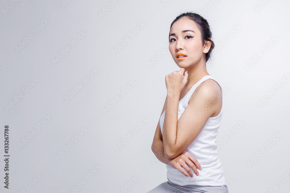 Beautiful woman cares for the skin face - posing at studio isola Beautiful woman cares for the skin face - posing at studio isola