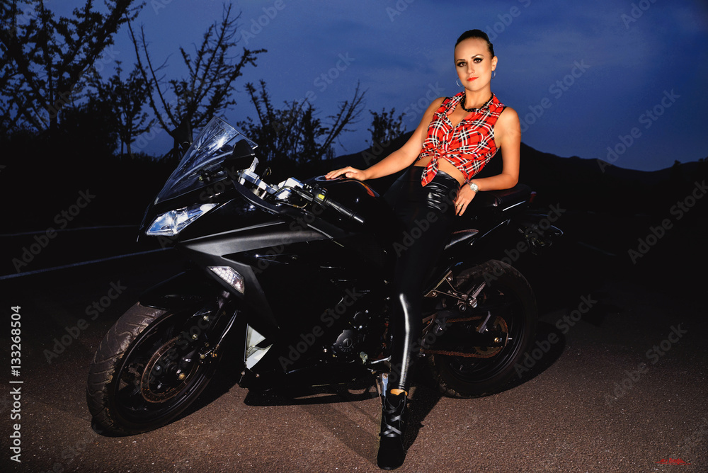 sexy girl on motorbike.sexy girl on motorbike. Black motorbike and wide  road. foto de Stock | Adobe Stock