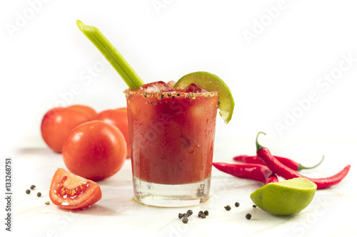 Bloody Mary cocktail with celery and lime photo