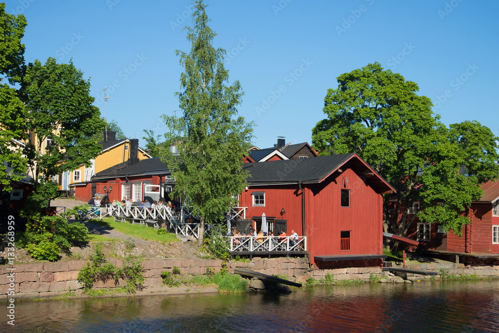 A view of summer cafe on the river bank of Porvoyoki in the old city porvoo
