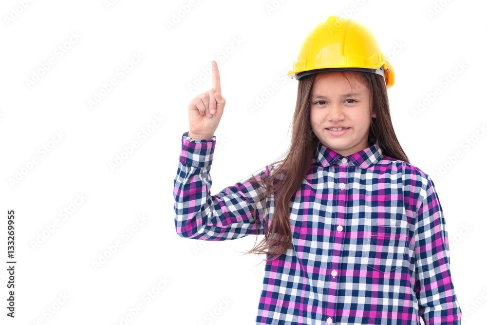 Little girl with a yellow helmet pointing finger up isolate on w Little girl with a yellow helmet pointing finger up isolate on w