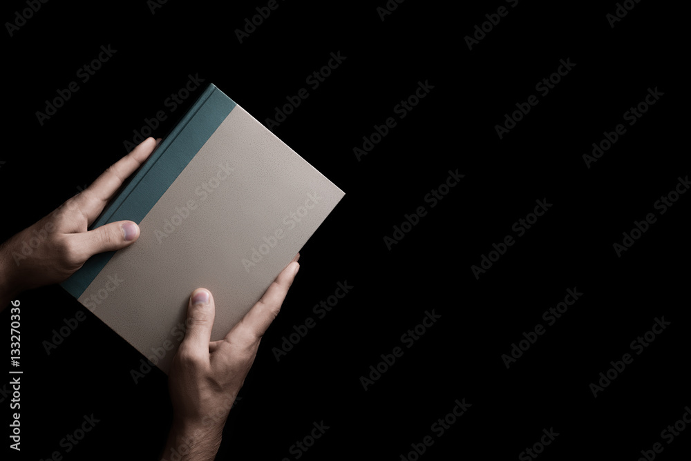 book in male hands book in male hands