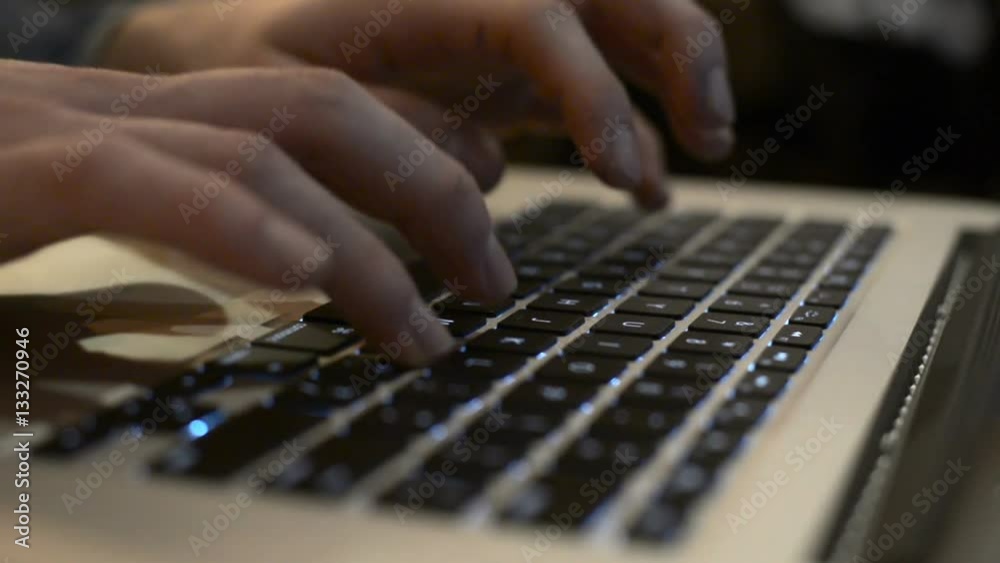 Man hands typing on a computer keyboard Man hands typing on a computer keyboard