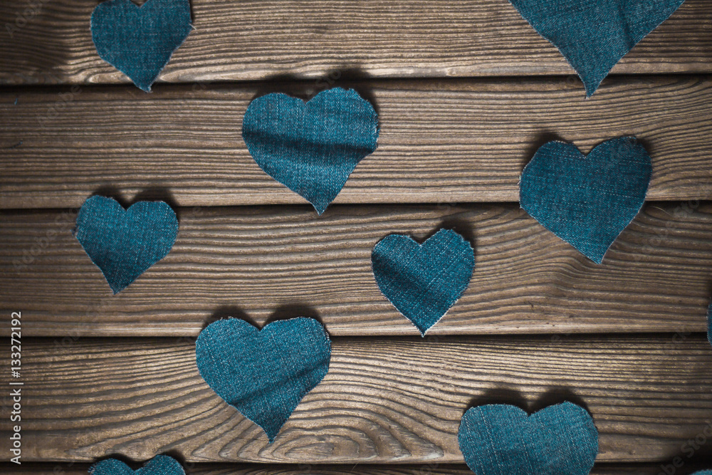 Valentine's day. wooden background with blue hearts.the photo ha