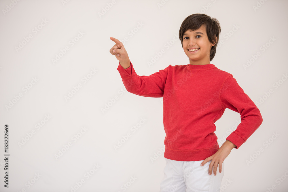 Cute school kid posing in studio with different facial expressio Cute school kid posing in studio with different facial expressio