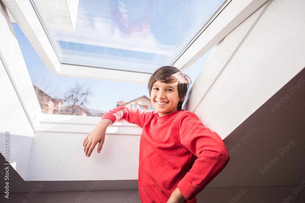 Kid on roof window in the room