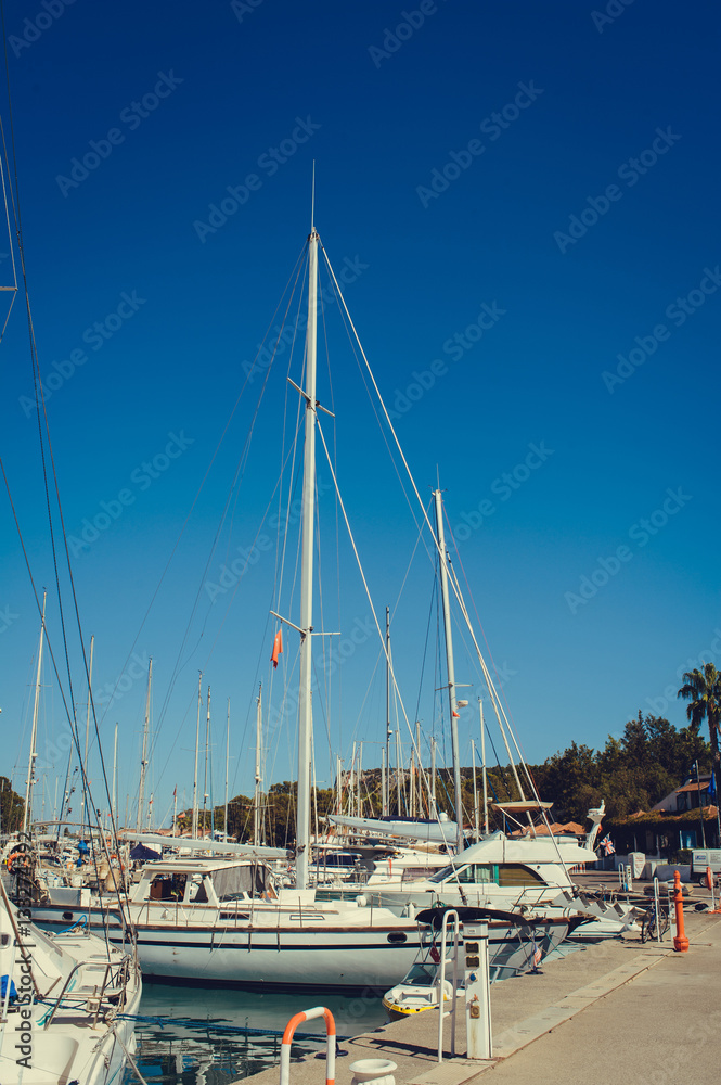 pier with yachts at sea