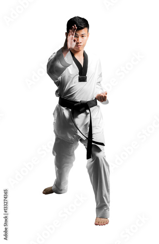 Portrait of a handsome asian man with taekwondo black belt . Iso