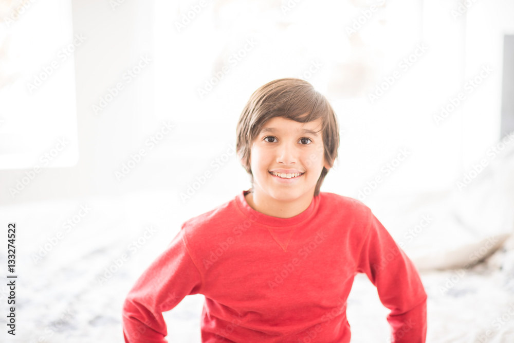 Kid in bedroom sleepin on bed with white sheet and pillow Kid in bedroom sleepin on bed with white sheet and pillow