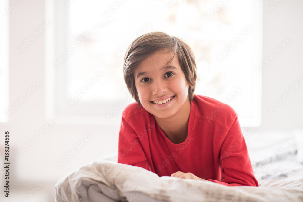 Kid in bedroom sleepin on bed with white sheet and pillow Kid in bedroom sleepin on bed with white sheet and pillow