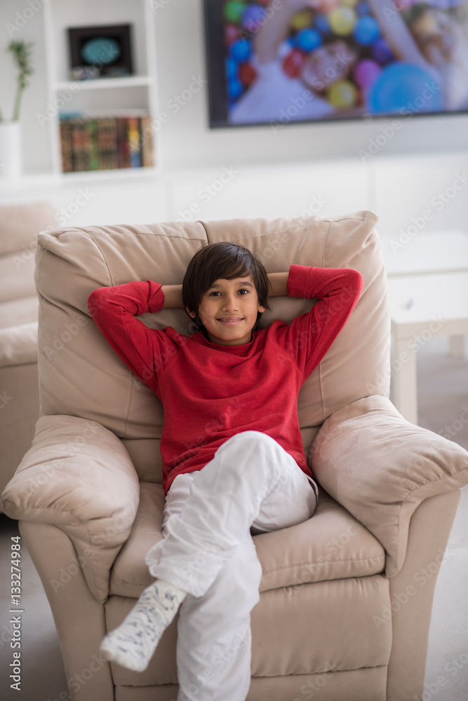Kid relaxed on sofa Kid relaxed on sofa