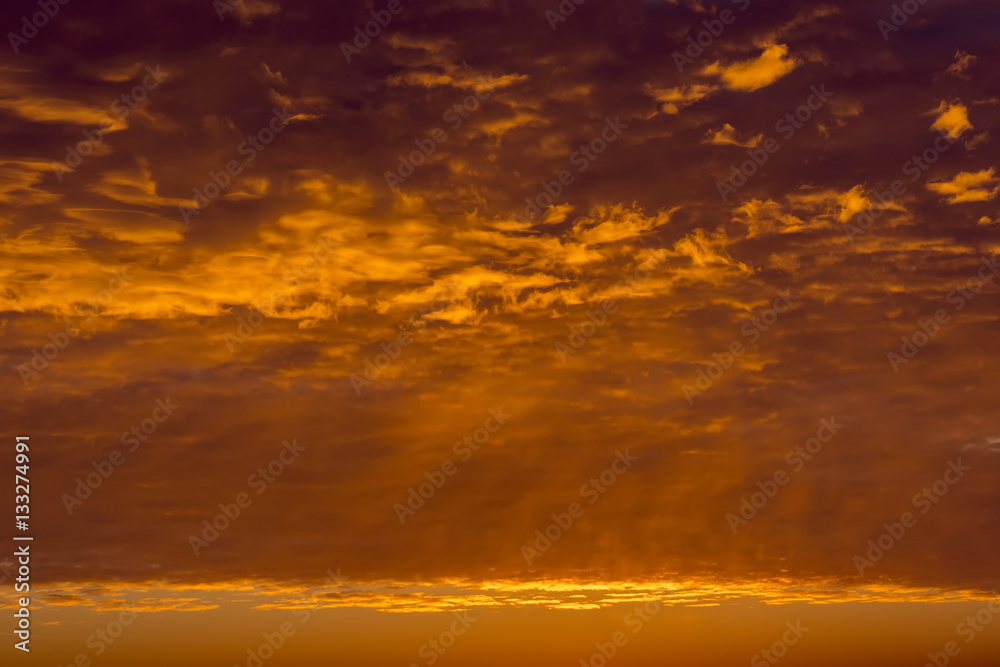 Sunrise sky covered with colorful clouds in various shades