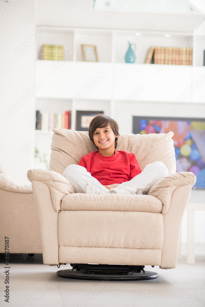 Kid relaxed on sofa Kid relaxed on sofa