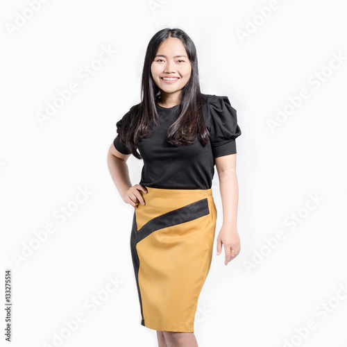 Portrait of a beautiful asian girl smiling and poses akimbo. Iso