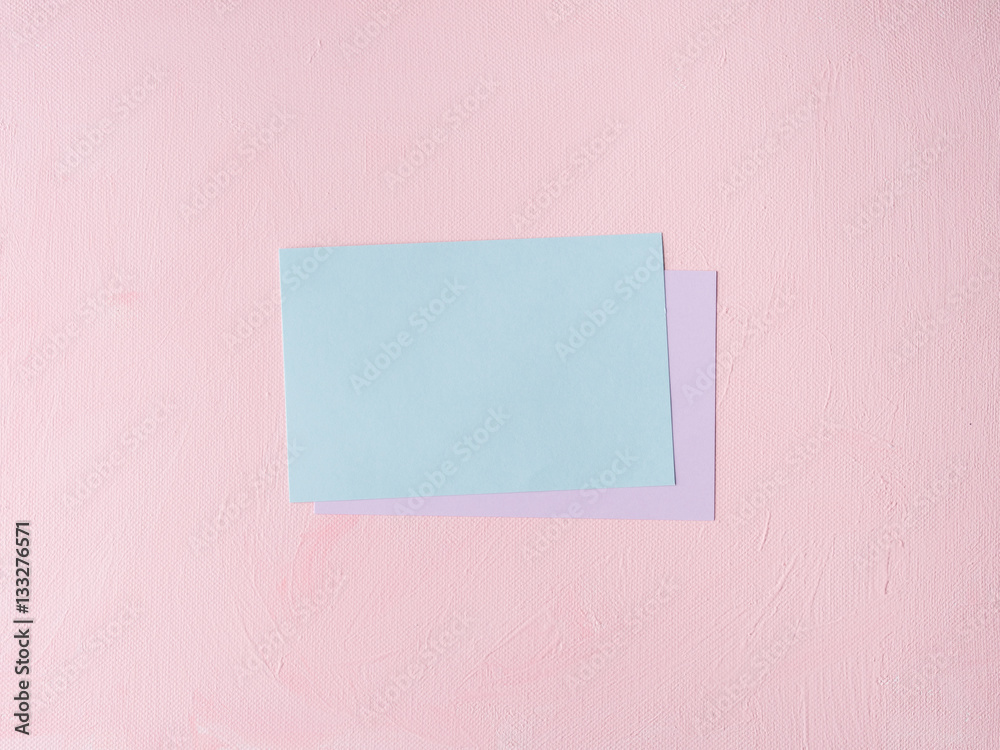 Green Pastel color card on pink textured background. Baby birthday party invitation or valentine. Copy space Green Pastel color card on pink textured background. Baby birthday party invitation or valentine. Copy space