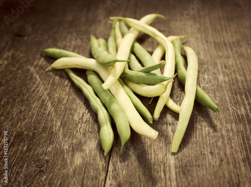 Green beans on a wooden table