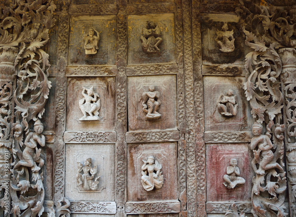 Decoration wood carving door in the temple in Myanmar.