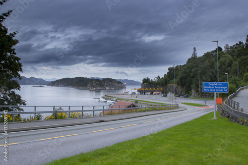 Small ferry terminal in Norway, car and passengers shipping proc photo