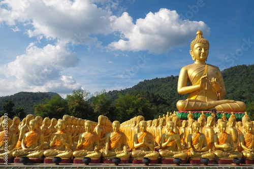 Buddha image of Lord buddha among the 1,250 monks, the symbol of Magha Puja day, Buddha Memorial park, Nakorn nayok, Thailand