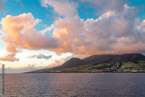 Orange Clouds in Blue Sky Over Green Island