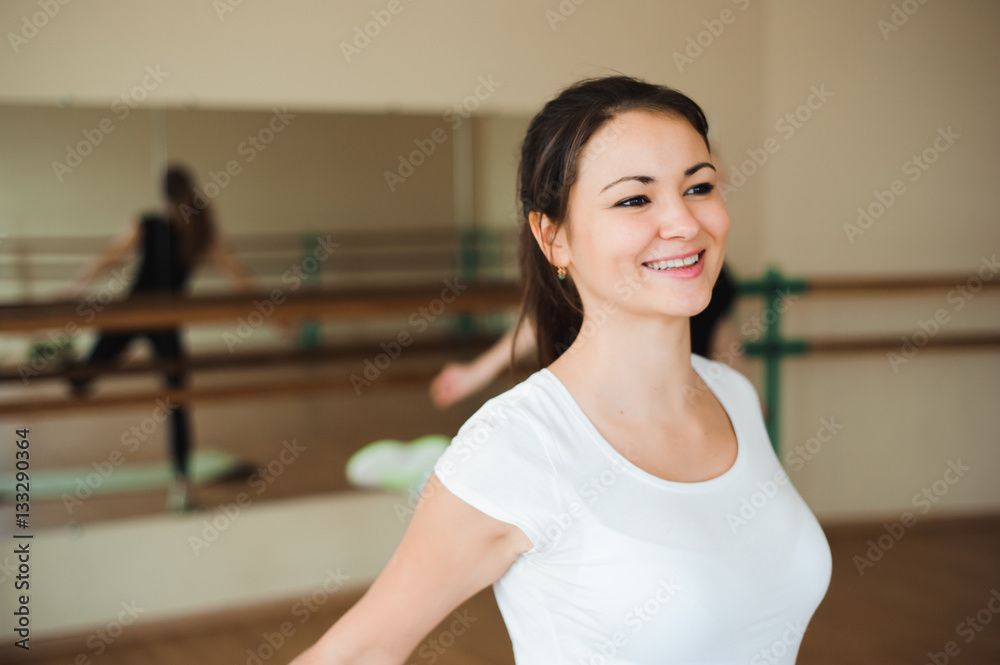 Group of three girls doing exercises in the gym.