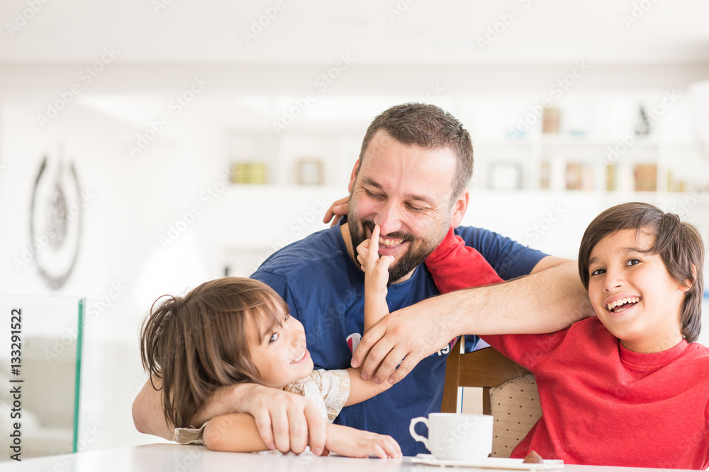 Happy father and son at modern new white home Happy father and son at modern new white home