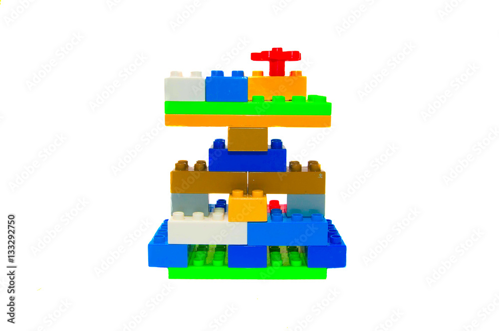 Obraz premium Colorful plastic building bricks on a white background