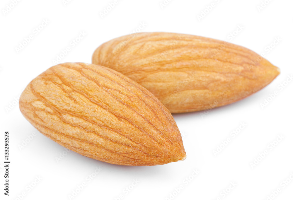 Closeup of two almond nuts isolated on white background