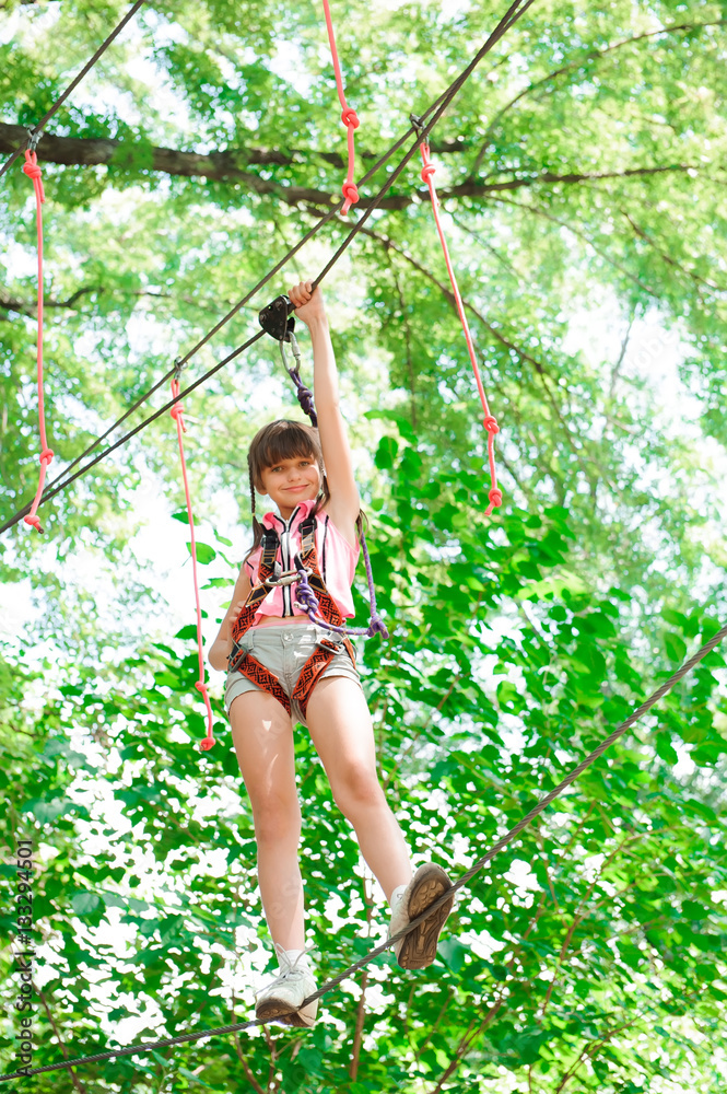 adventure climbing high wire park - hiking in the rope park girl adventure climbing high wire park - hiking in the rope park girl