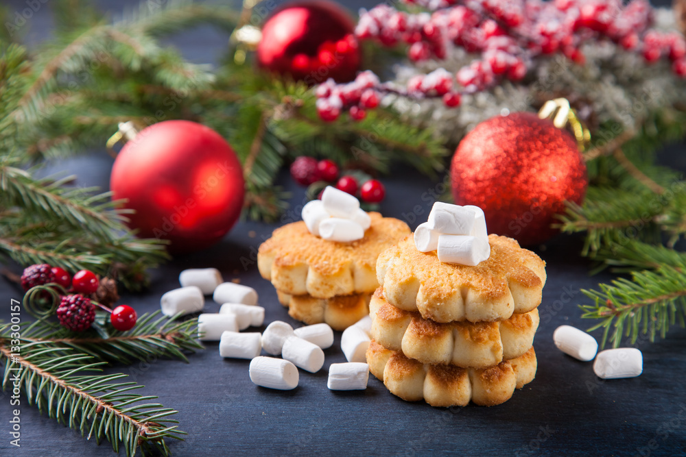 cookies about marshmallows and Christmas balls on a table, selective focus, copy space cookies about marshmallows and Christmas balls on a table, selective focus, copy space