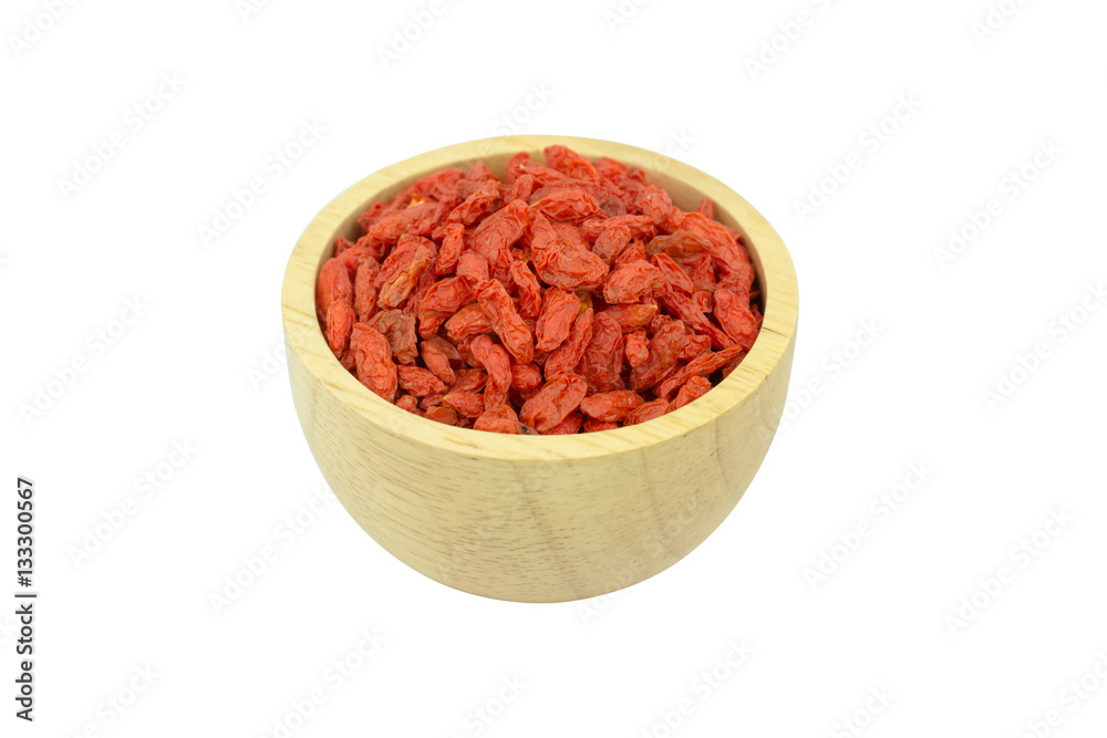 goji berries in wood bowl isolated on white background goji berries in wood bowl isolated on white background