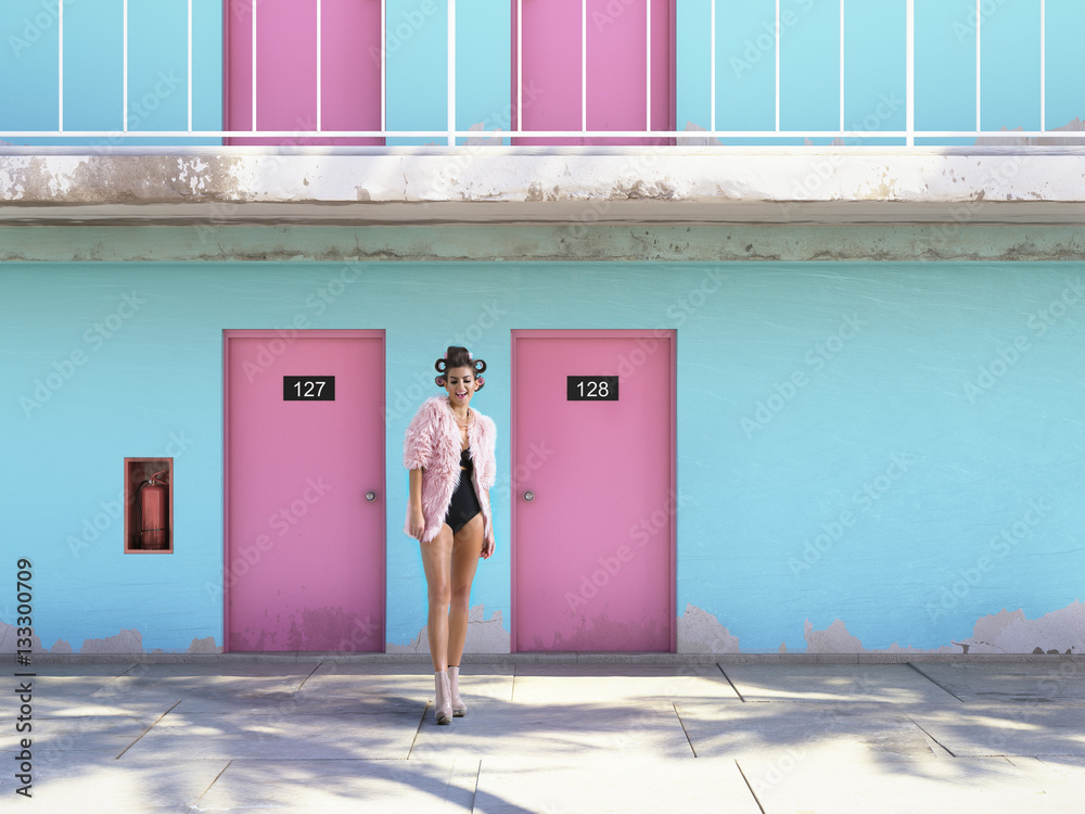 woman walking from abandoned motel with pink doors. vacation concept - obrazy, fototapety, plakaty 