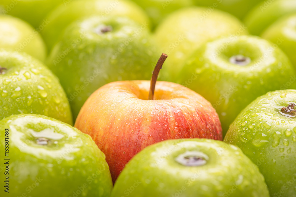 Green fresh apples and red apple close up, selective focus. Green fresh apples and red apple close up, selective focus.
