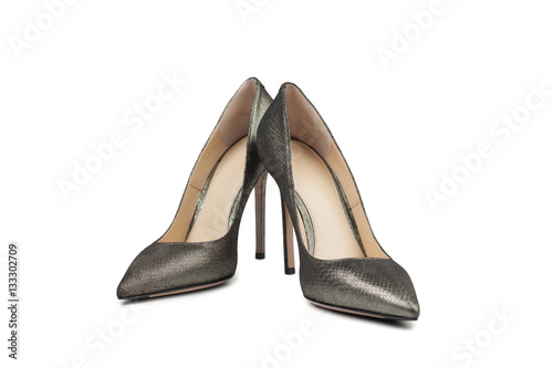 Metallic female high heel shoes on white background 