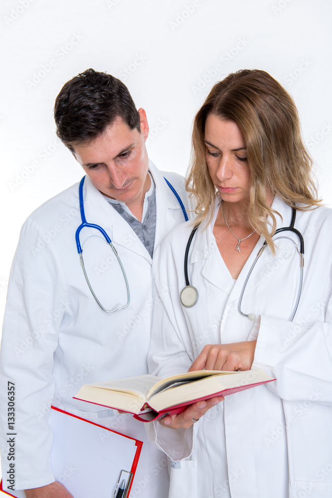 young friendly medical team with book in lab coat young friendly medical team with book in lab coat