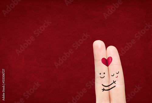 Couple in love with your finger on a solid background.