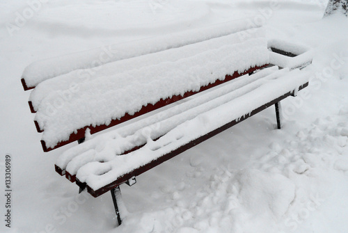 Winter. Bench under the snow