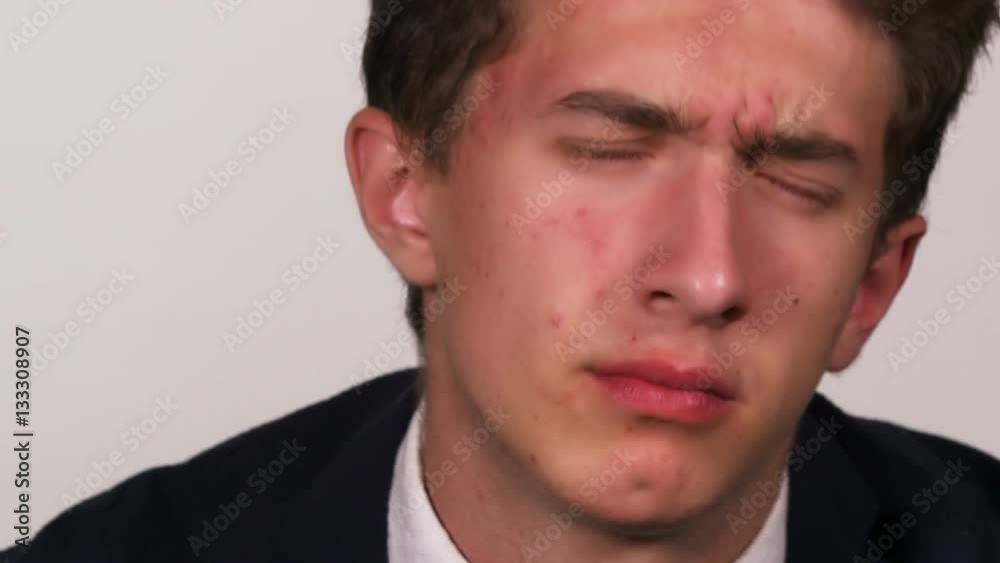 Portrait of approving young guy nodding Portrait of approving young guy nodding