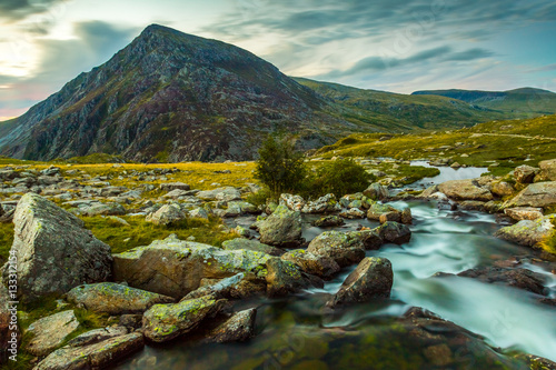 en yr Ole Wen and mountain stream in Snowdonia National Park Wales. the seventh highest mountain in Snowdonia and in Wales. It is the most southerly of the Carneddau range. photo